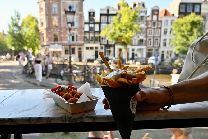 10 Tastes of Amsterdam: Food Tour by UNESCO Canals and Jordaan - Hans Egstorf stroopwafels: sticky-sweet, made in front of you