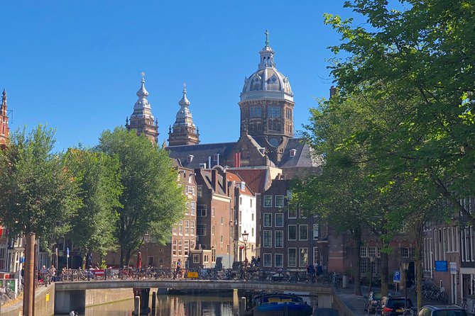 Absolutely Amsterdam - the Essential Introductory Walking Tour - Stop 5–6: The Waag for Rembrandt, then Oostindisch Huis and Amsterdam’s trading engine