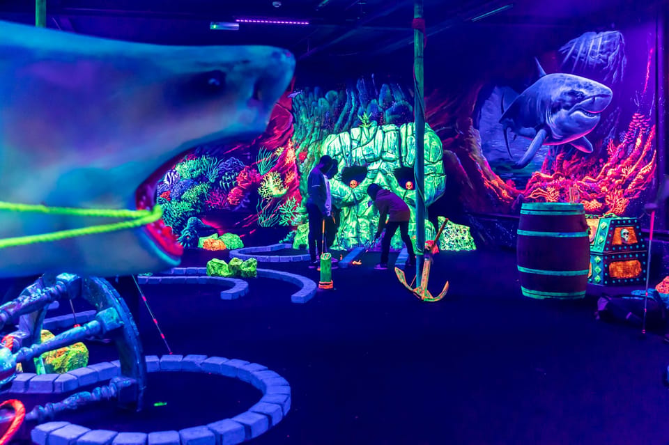 Aloha Amsterdam: 12-Hole Glow-in-the-Dark Mini-Golf - The pirates-on-ships and underwater design