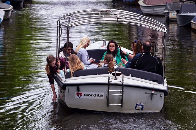 Amsterdam 90-min Private Canal Cruise with Live Guide and Drinks - Amstel and modern-meets-old Amsterdam