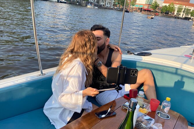 Amsterdam 90-min Private Canal Cruise with Live Guide and Drinks - Jordaan after dark: the quieter Amsterdam route