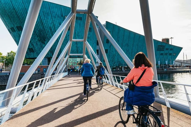 Amsterdam: Bike Tour with Optional Cruise in Small-Group - De Gooyer windmill and Magere Brug: the stops built for photos