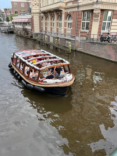 Amsterdam: Boat Tour with Optional Unlimited Drinks - The Night Route: Red Light District to Rembrandt Area Lights