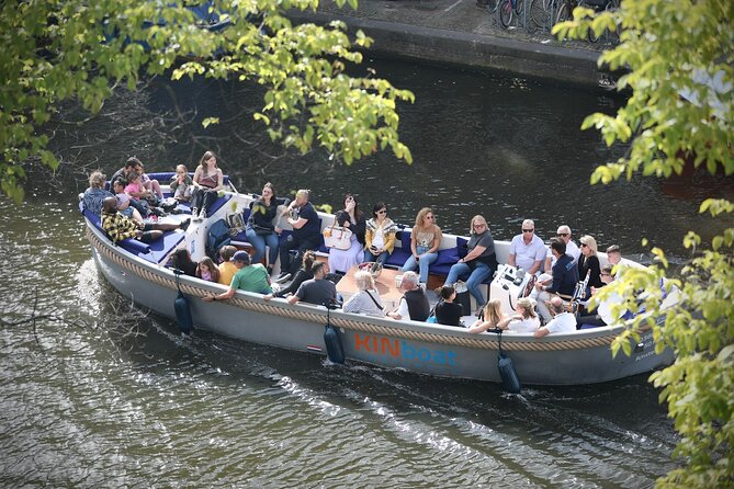 Amsterdam Canal Cruise in Open Boat with Unlimited Drinks Option - An open electric boat ride through UNESCO canals