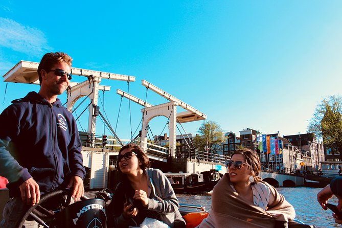 Amsterdam Canal Tour by Open Boat – 90 min Small Group Experience - Small open boat comfort: blankets, rain cover, and why it changes everything