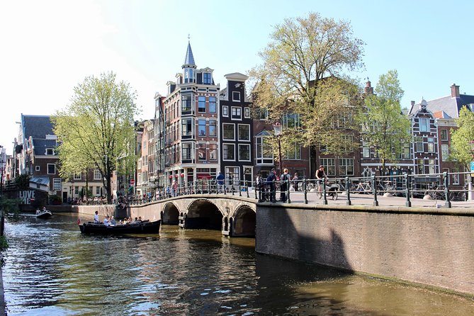 Amsterdam Canal Tour by Open Boat – 90 min Small Group Experience - Stop-by-stop: from the Amstel side to the Skinny Bridge