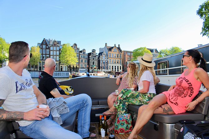 Amsterdam Canal Tour by Open Boat – 90 min Small Group Experience - The guide factor: live stories beat recorded spiels