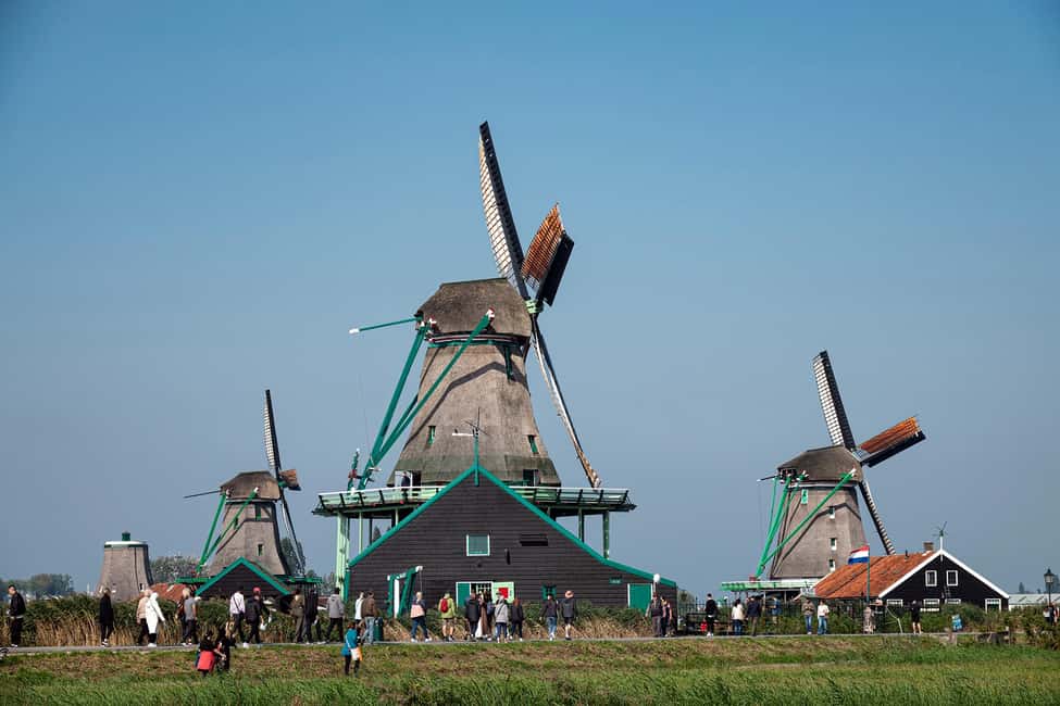 Amsterdam: Explore Zaanse Schans: Half-Day Luxury Coach Trip - Getting to the meeting point: the quick ferry + walk start