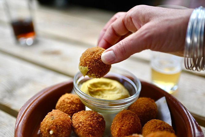Amsterdam Food Tour of 10+ Local Classic Tastings in Jordaan Area - Landmarks you pass: Westertoren, the memorial, and Anne Frank context