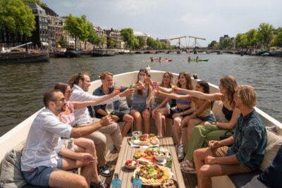 Amsterdam: German Guided Canal Cruise with on Board Bar - Electric Canals: The Feel of a Quiet Boat and On-Board Drinks