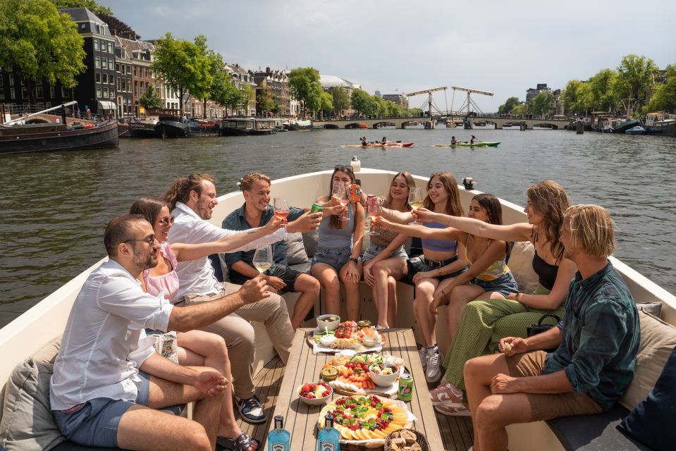 Amsterdam: German Guided Canal Cruise with on Board Bar - Electric Canals: The Feel of a Quiet Boat and On-Board Drinks