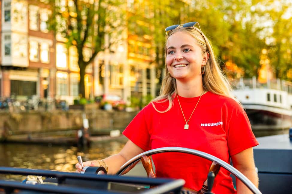 Amsterdam: Guided Open Boat Canal Cruise Including Drink - Should you book this Amsterdam open-boat canal cruise?