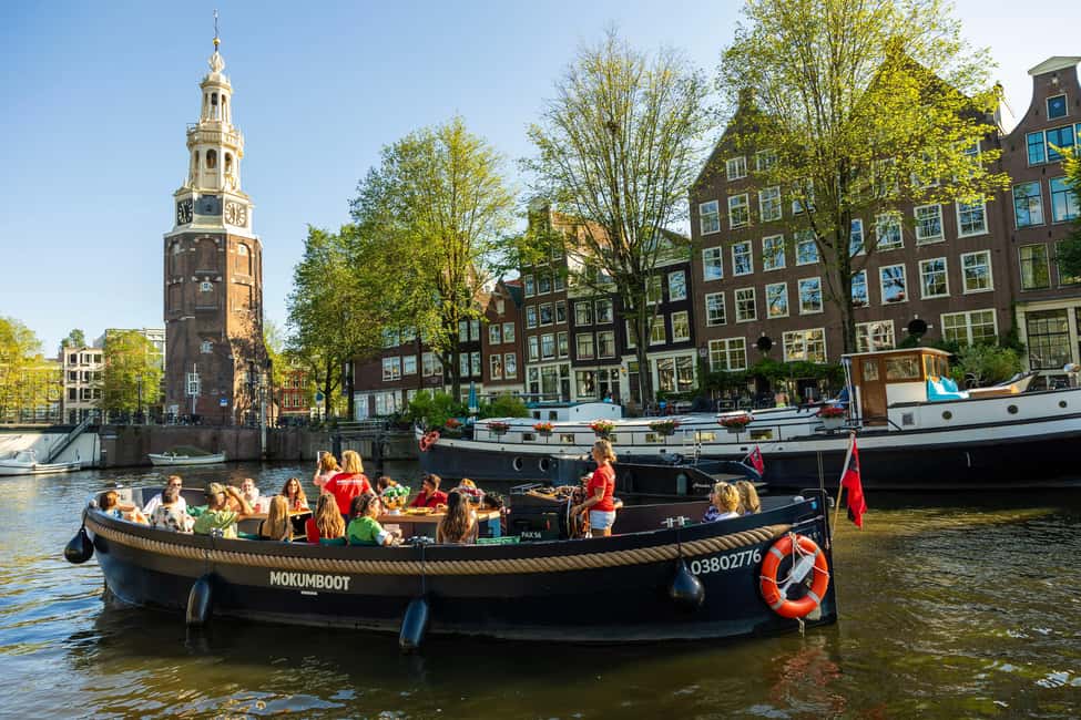 Amsterdam: Guided Open Boat Canal Cruise Including Drink - Your one-hour route: what you’ll see at each major photo stop