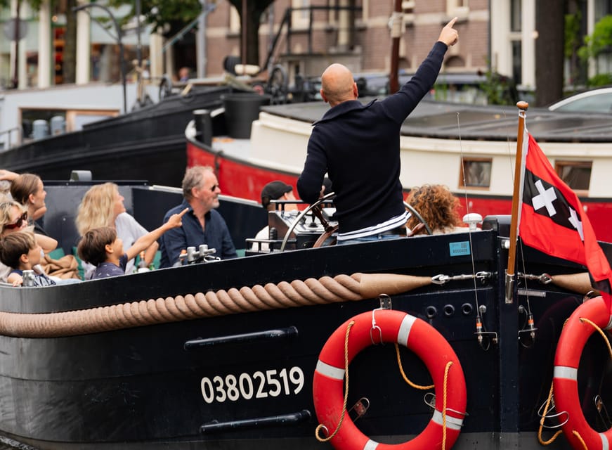 Amsterdam: Guided Open Boat Canal Cruise Including Drink - Drink choice: one drink included, unlimited if you upgrade