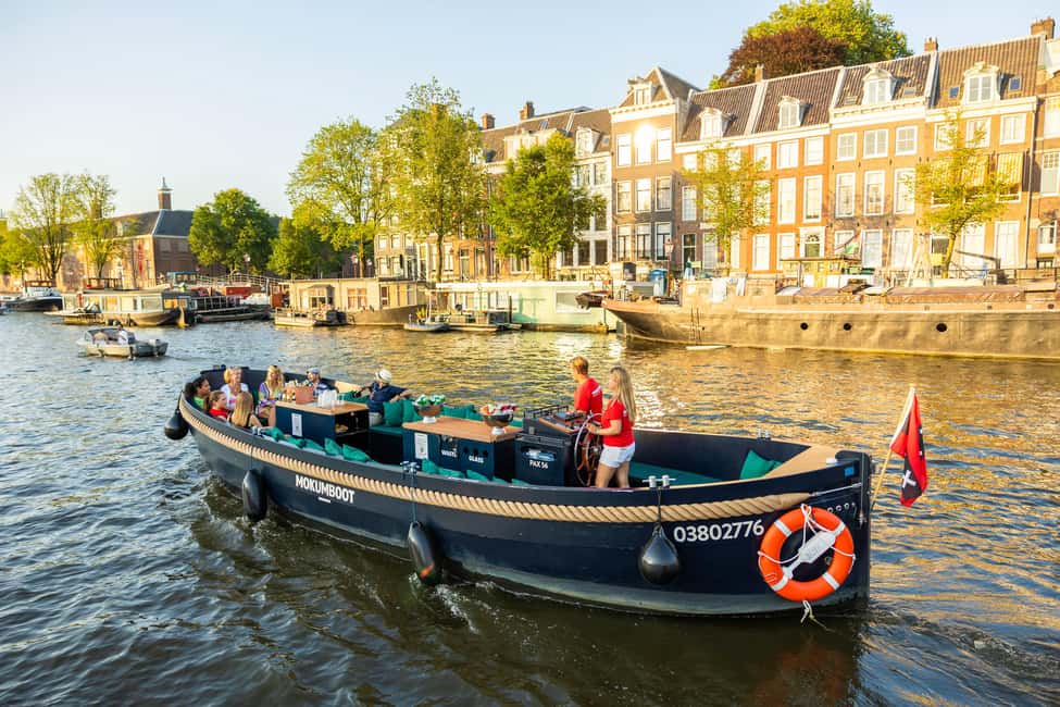 Amsterdam: Guided Open Boat Canal Cruise Including Drink - Who this cruise is best for