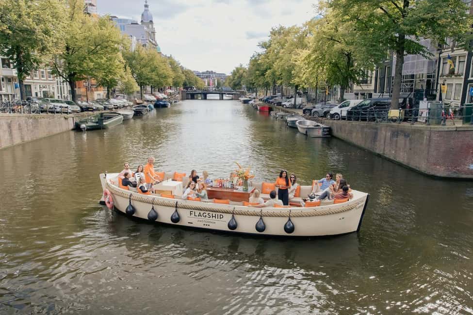 Amsterdam: Open Boat Cruise option Unlimited Drinks & Bite - How the Guide Turns Sights Into Meaning