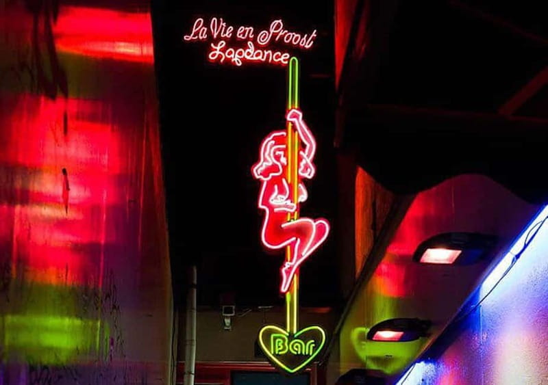 Amsterdam: Red Light District Tour in German/English/Italian - Condomerie and the contraception story (10 minutes that matter)
