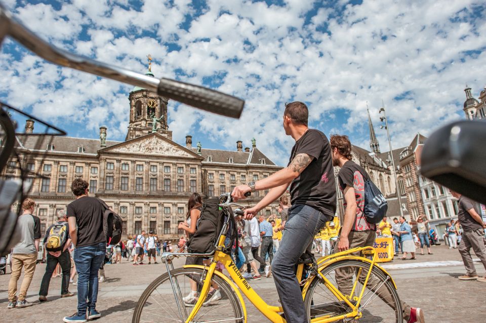 Amsterdam: Relaxed City Highlights Guided Bike Tour - Leidseplein: music, squats, and the city’s edge
