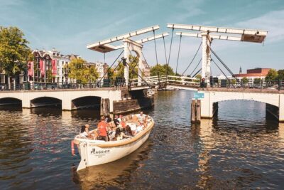 Amsterdam: Saloon Boat Cruise + Unlimited Drinks & Bite option - On the Amstel: Amsterdam’s Founding Waterway
