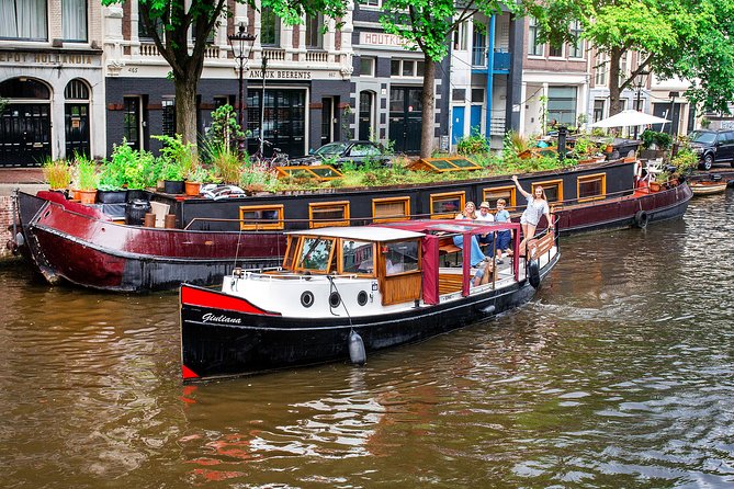Amsterdam Small-Group Canal Cruise With Dutch Snacks and Drink - Amstel, bridges, maritime museums, and the zoo area