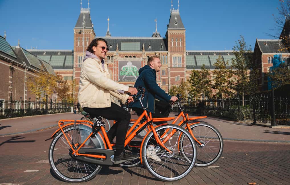 Amsterdam: Top Highlights Guided Bike Tour EN/DE/ES/FR/IT/CN - Pace and expectations: why you’ll feel satisfied, not exhausted