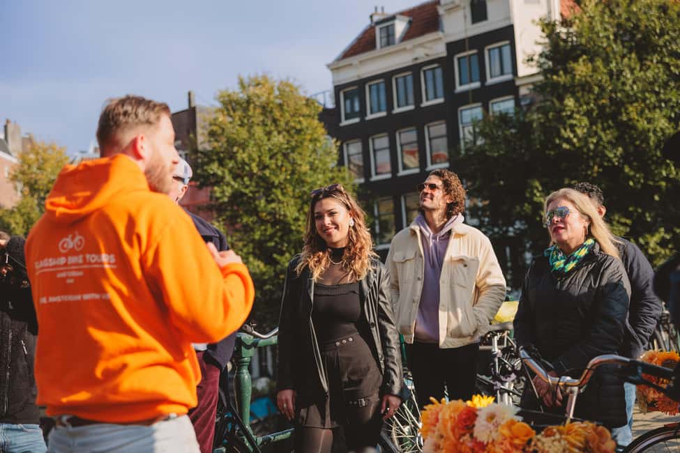 Amsterdam: Top Highlights Guided Bike Tour EN/DE/ES/FR/IT/CN - Riding past the Red Light District to Leidse Square food-market time