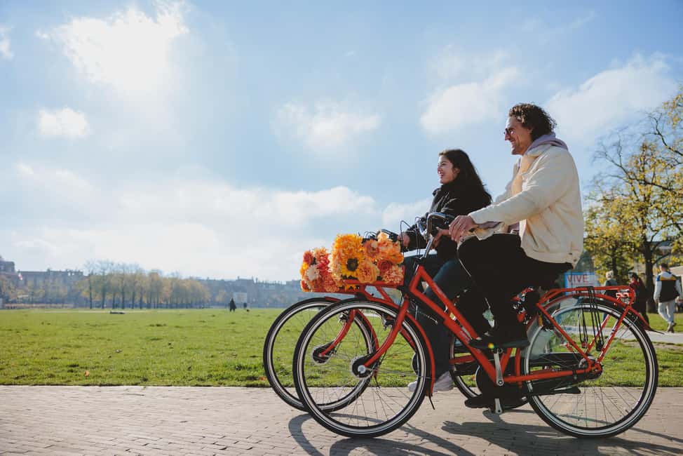 Amsterdam: Top Highlights Guided Bike Tour EN/DE/ES/FR/IT/CN - De Negen Straatjes and Dam Square: small streets to big square in one sweep