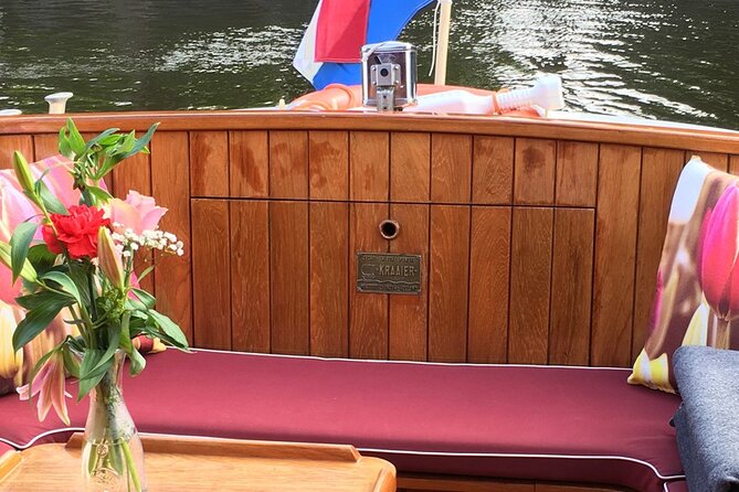 Cruise Amsterdam like a Local — Small Group 12 pax - The boat setup: heated comfort, sliding windows, and photo-friendly speed