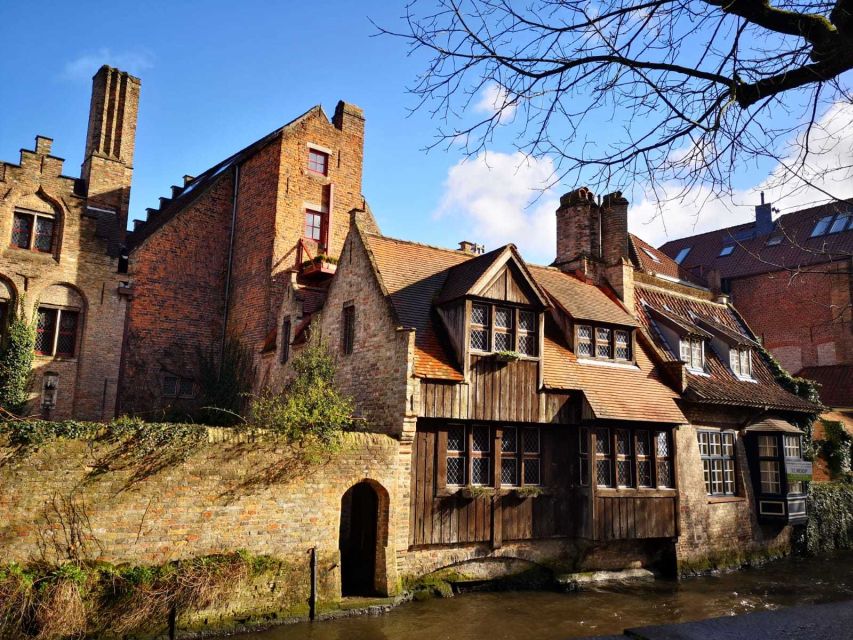 From Amsterdam: Bruges Day Trip in English with Boat Option - The guided walk: Minnewater, Begijnhof, and the Church of Our Lady tower