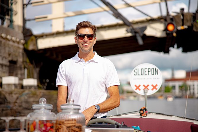 Guided Amsterdam Canal Cruise – Snacks & Drinks on board(1 Hour) - Stop 2: Amsterdam’s oldest building (1306) in the middle of it all