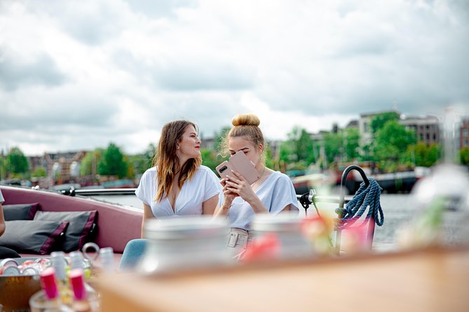 Guided Amsterdam Canal Cruise – Snacks & Drinks on board(1 Hour) - Stop 4: a ship-shaped futuristic building rising out of the water